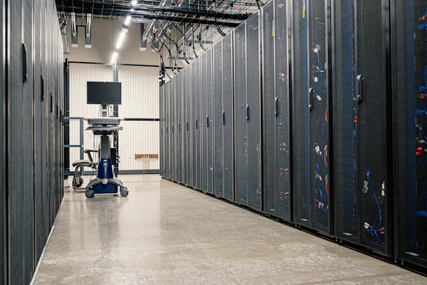 Data center server room representing enterprise IT infrastructure for business automation