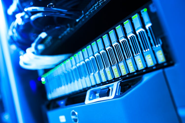 Blue-lit server hardware in data center representing stable deployed technology infrastructure